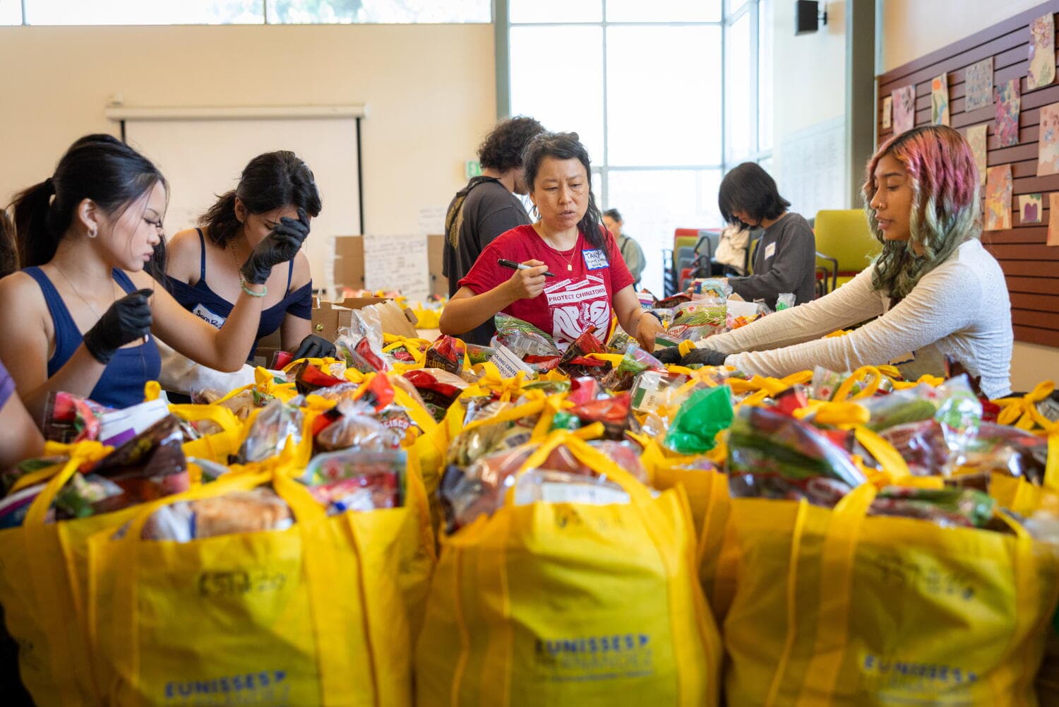 Chinatown elders need groceries. These teens go door-to-door delivering them